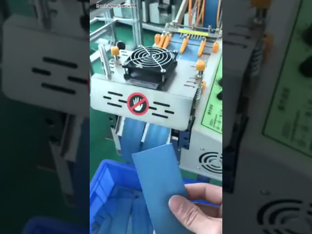 Mesin Potong Kain & Tape Otomatis dengan Pisau Dingin – Solusi Tepat untuk Stiker, Resleting, Elastis & Zipper